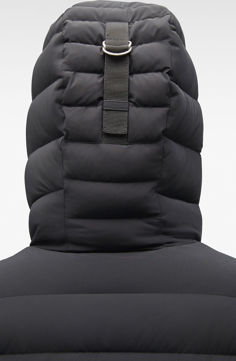 Close up of a dark puffy hood.