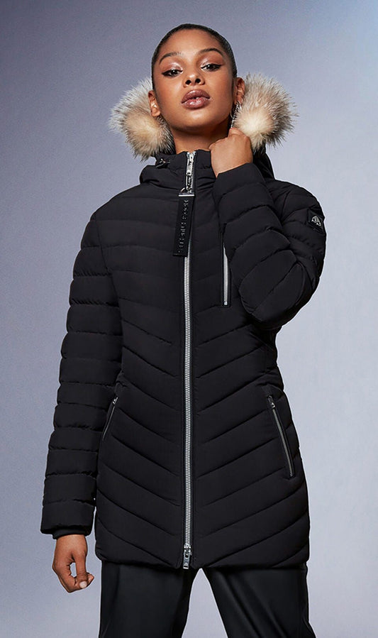 A person wears a black puffer coat with fur lined hood, zippered closure, and zippered side pockets.