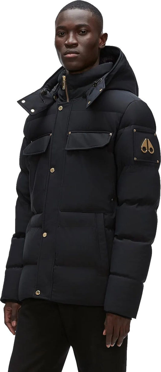 A black puffer jacket with a hood, four pockets and gold hardware.