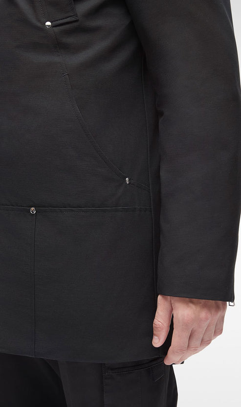Black coat with pocket details and silver buttons.