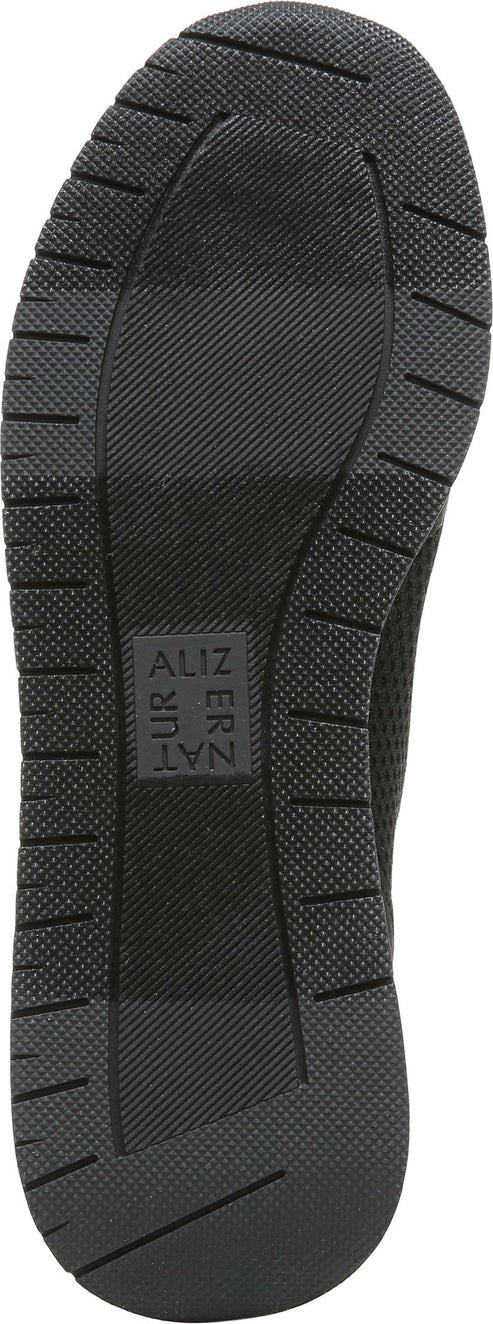 Sole of a shoe with a textured, ribbed pattern and a small logo.