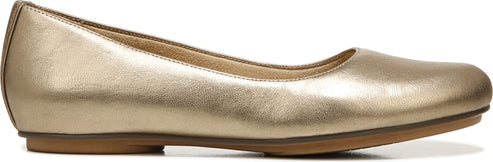 A gold-colored ballet flat shoe.