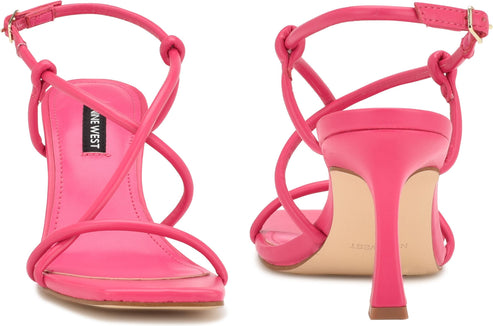 Pair of hot pink high-heeled sandals with knot and criss-cross strap detail and text "NINE WEST".