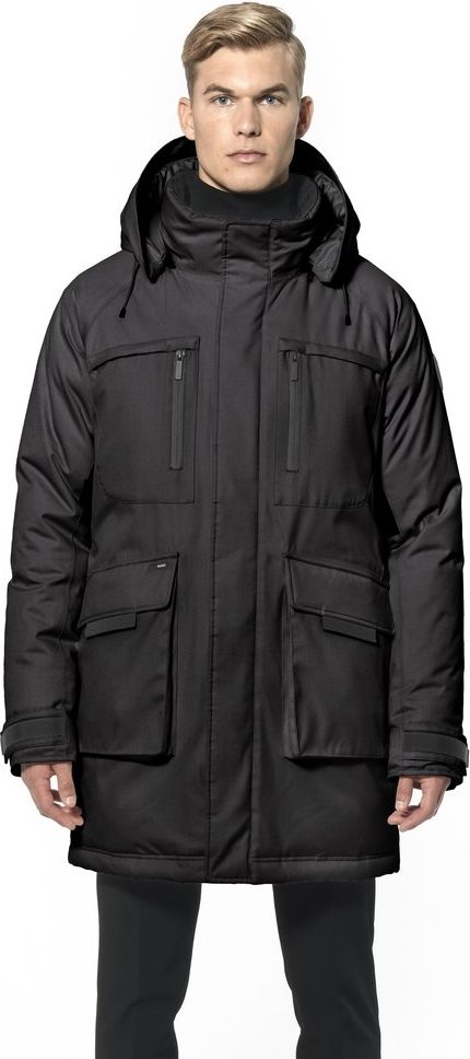 A man wearing a black hooded parka.