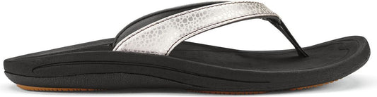 A flip-flop with a silver strap and a black sole.