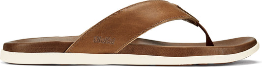A brown leather sandal with a white sole.