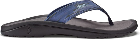 A sandal with a blue patterned strap.