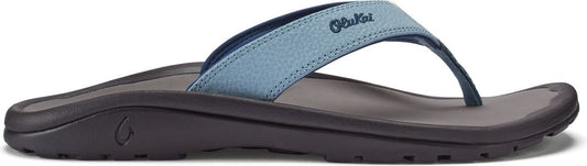 A flip-flop with a blue textured strap and black sole.