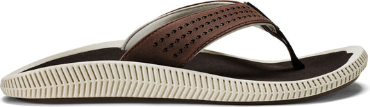 A brown flip-flop with a perforated strap and a black toe post.