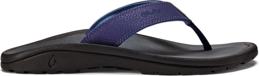 A navy blue flip-flop with a black sole.