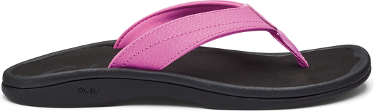 A pink flip-flop with a black sole.