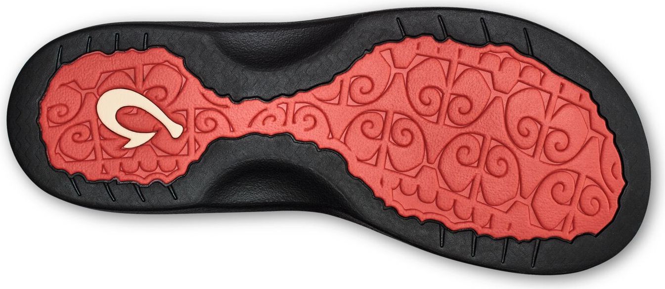 A sandal's sole has a red patterned portion surrounded by black, with a stylized hook logo on the side.