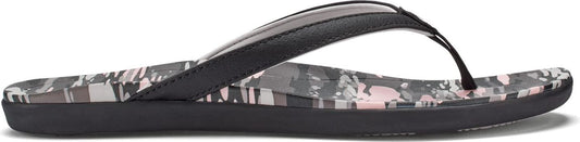 A black flip-flop sandal with a patterned insole.