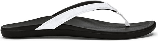 A black flip-flop with a thick white strap.