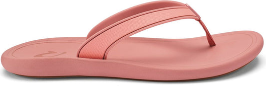 A pink sandal with a matching strap.