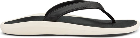 A black flip-flop sandal with a thick, white sole.