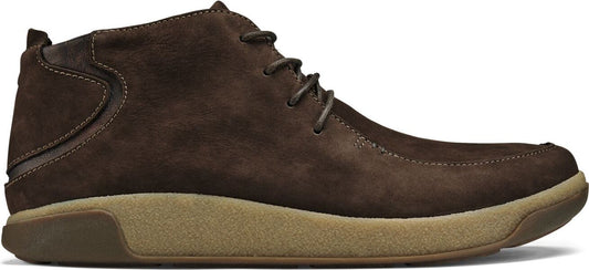 A brown suede chukka boot with tan soles and laces.