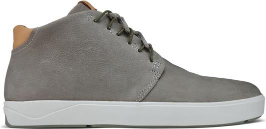 A gray chukka shoe with a white sole.