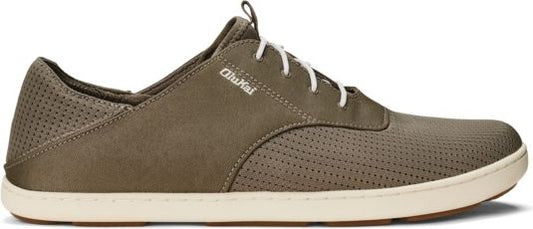 Olive-green low top shoe with white laces and off-white sole.