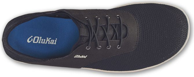 Top-down view of a black sneaker with white insole text.