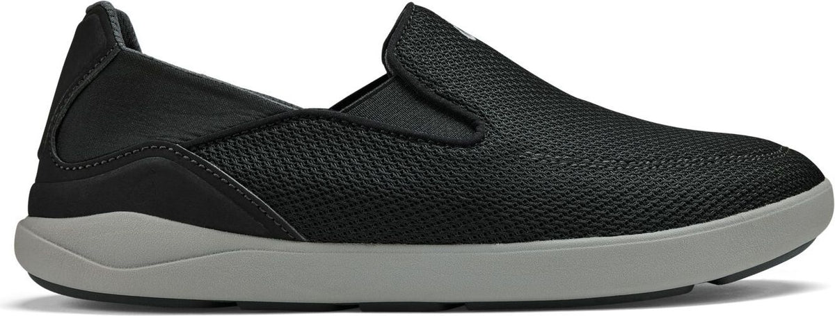 A black slip-on shoe with a gray sole.