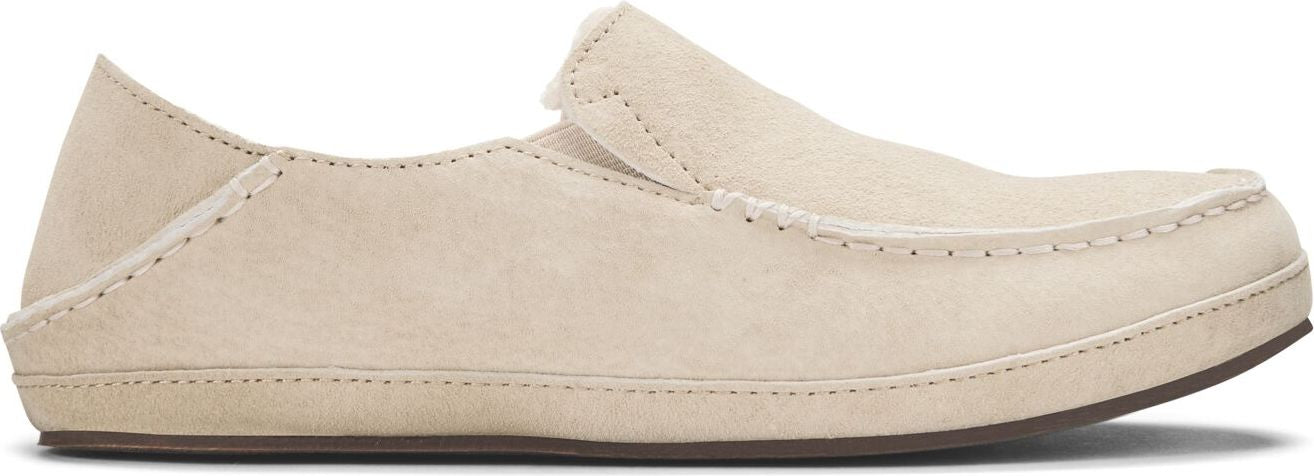 A slip-on shoe with a light tan, textured exterior and minimal stitching.
