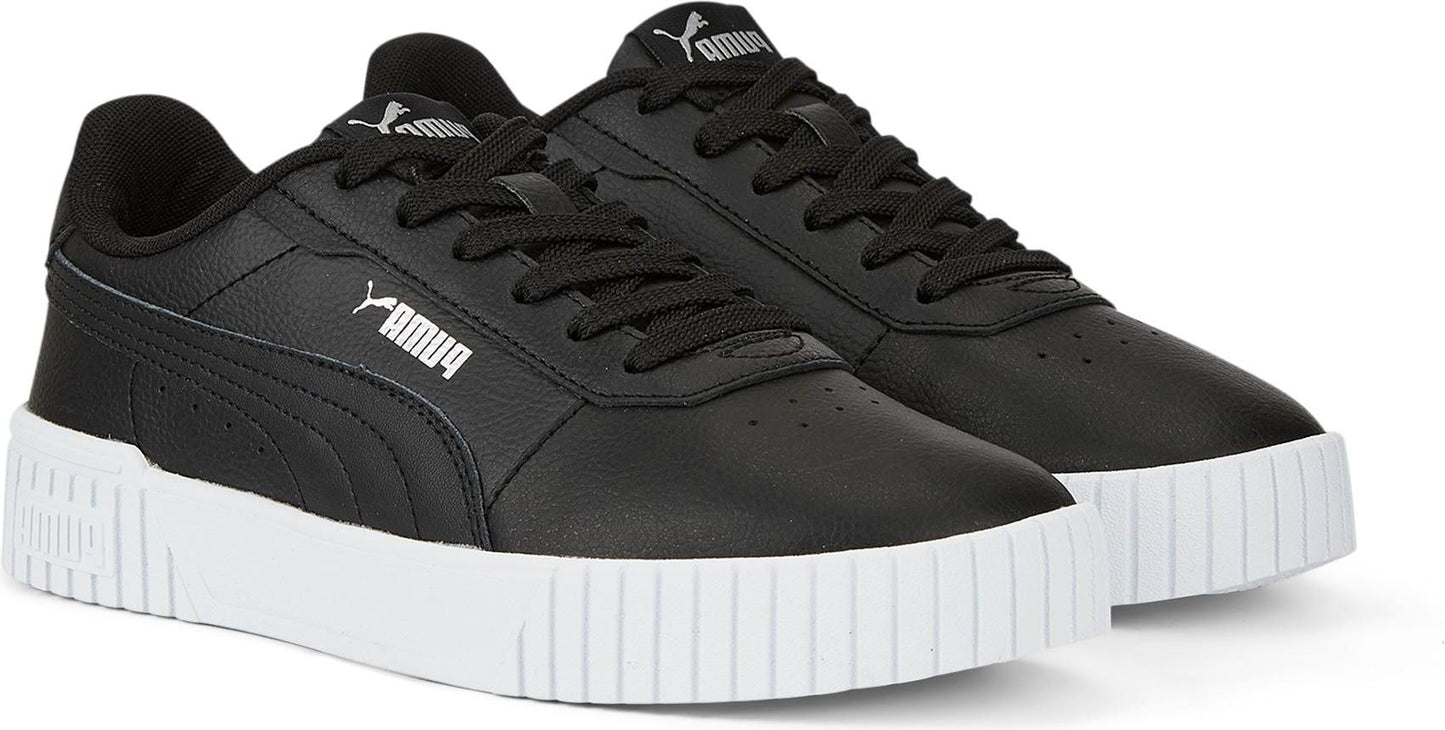A pair of black low top sneakers with white soles. The word 'AMUQ' is printed on the side of the left shoe.