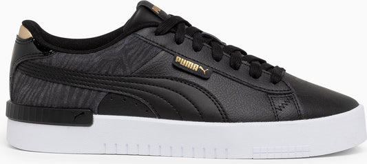 A black Puma sneaker with gold accents on a white platform sole.