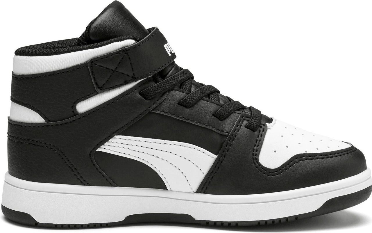 Black and white high-top sneaker with laces and velcro strap.