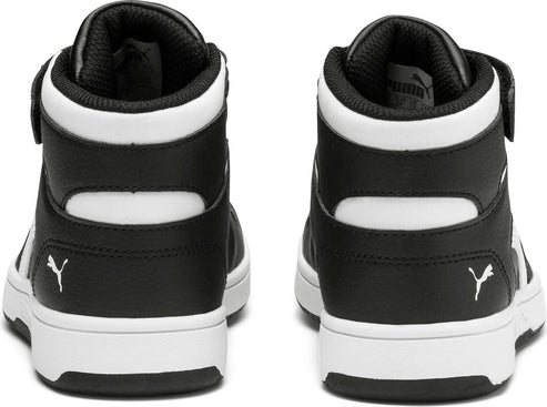 Rear view of black and white high-top sneakers with strap and logo.