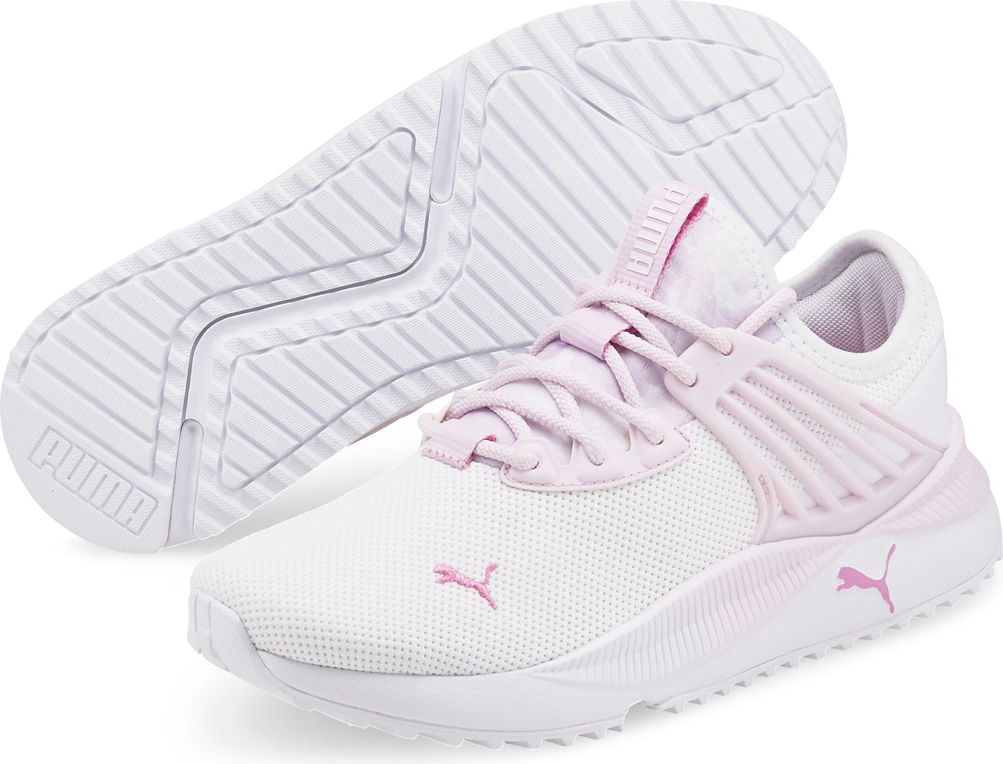 A white and pink athletic shoe with white laces and pink logo.