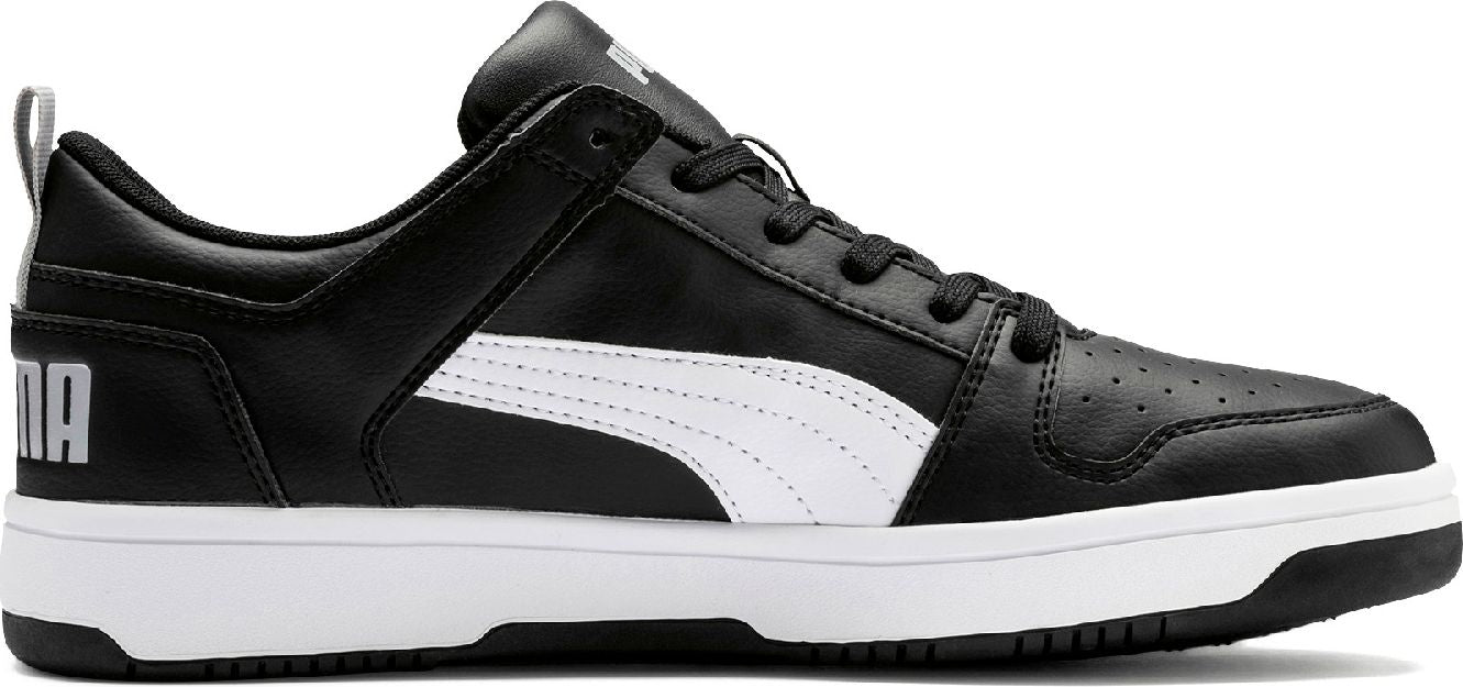 A black and white sneaker with the letters 'PUMA' on the back.