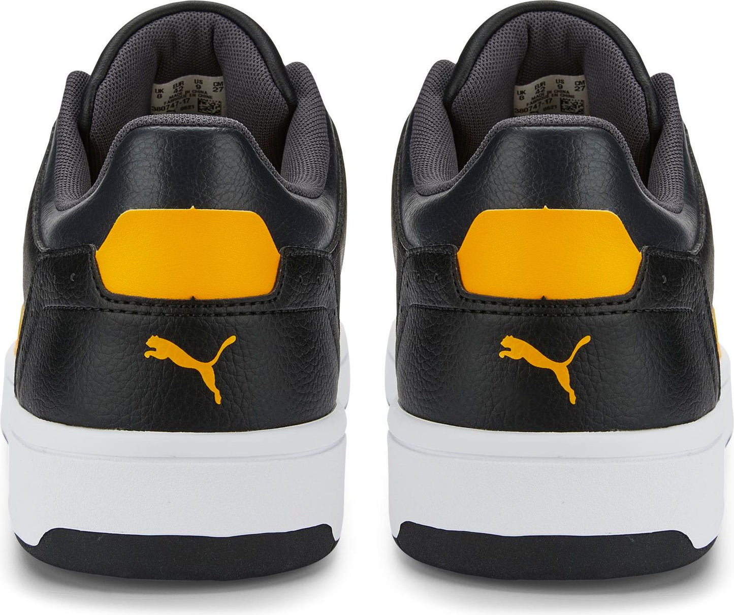 Back view of two identical black sneakers with yellow accents and white soles, displaying the brand's logo.