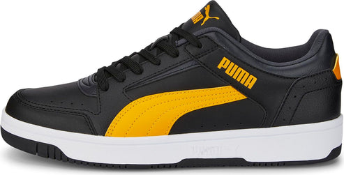 A black sneaker with a yellow stripe on the side and a white sole. The word PUMA is on the side in yellow.