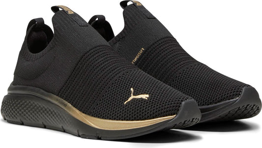 Pair of black slip-on sneakers with gold accents.