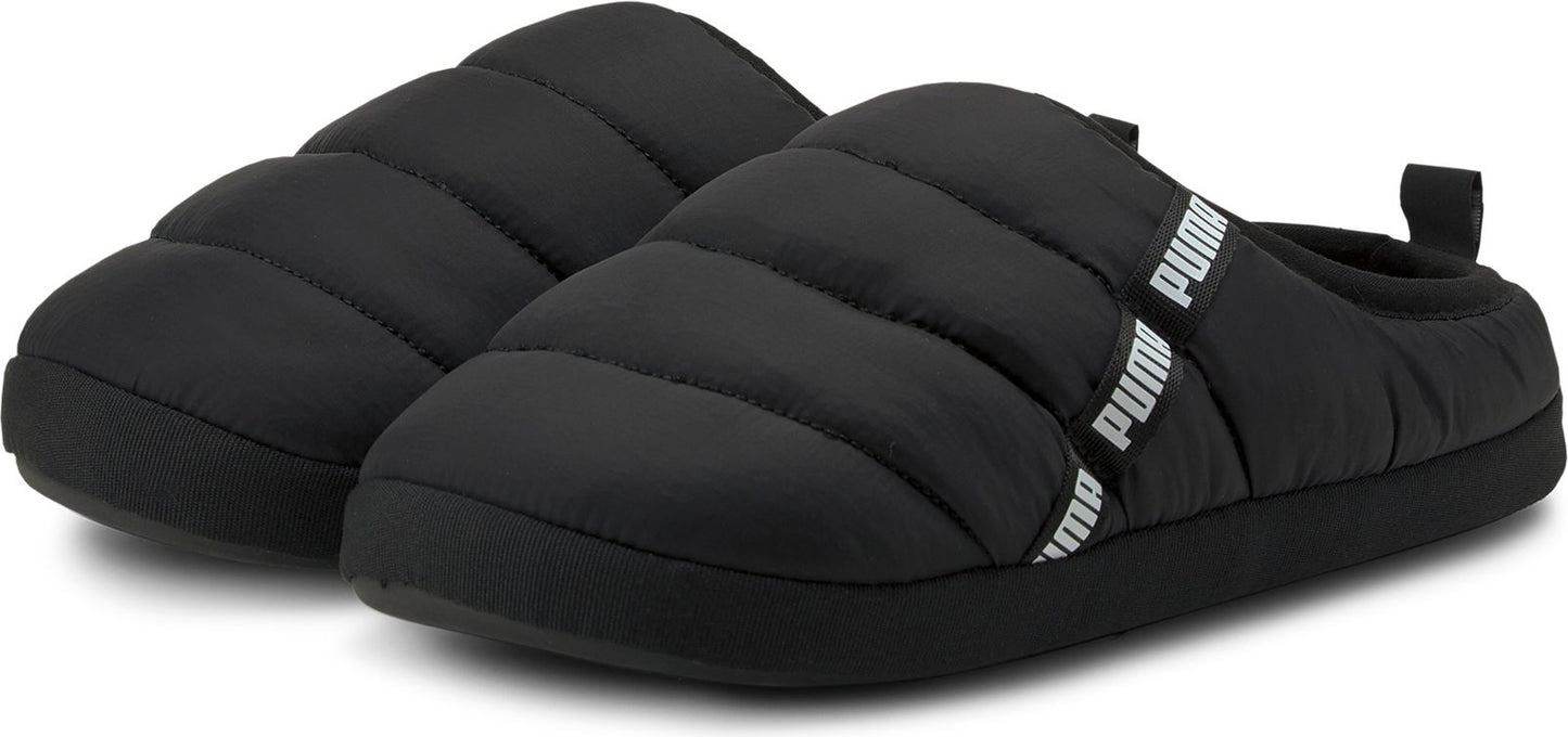 A pair of puffy, black slippers with a rubber sole and the word PUMA printed on the strap.