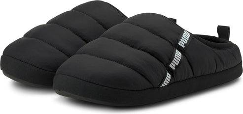 A pair of puffy, black slippers with a rubber sole and the word PUMA printed on the strap.