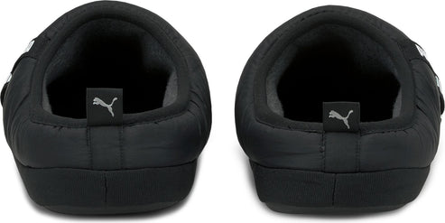 Two back-facing black slippers with Puma logos on the heel.