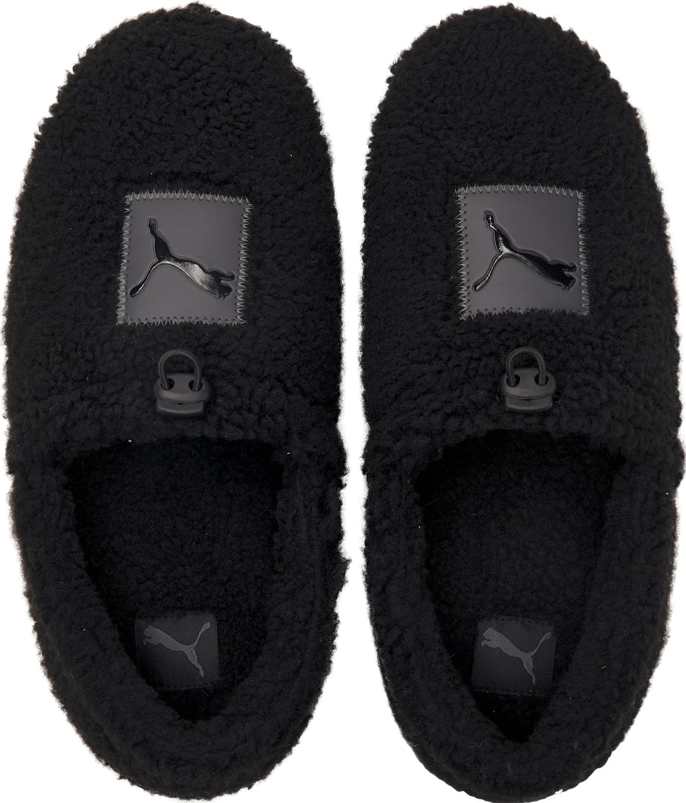 Pair of fuzzy black slippers with Puma logo patches.