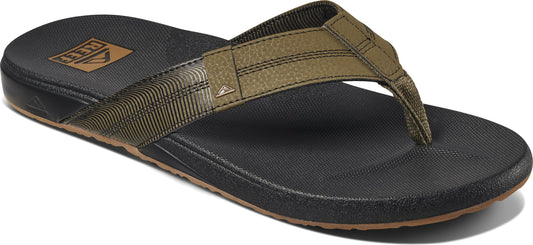 A flip-flop with a black sole and a green strap.
