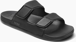Black sandal with two adjustable straps and the word "REEF" on the side.