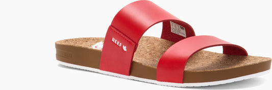 A red, two-strap sandal with a brown cork footbed and a white sole.