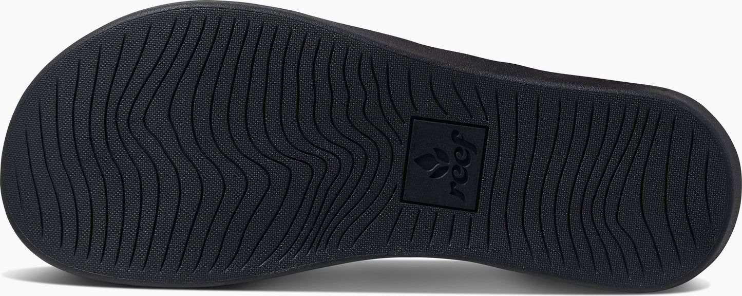 black rubber sole with wavy treads and Reef logo