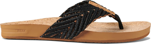 A black woven sandal with a brown sole.