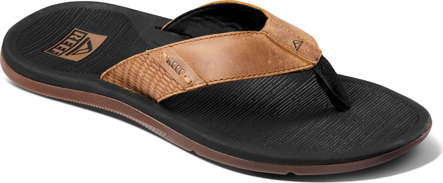 A brown leather sandal.