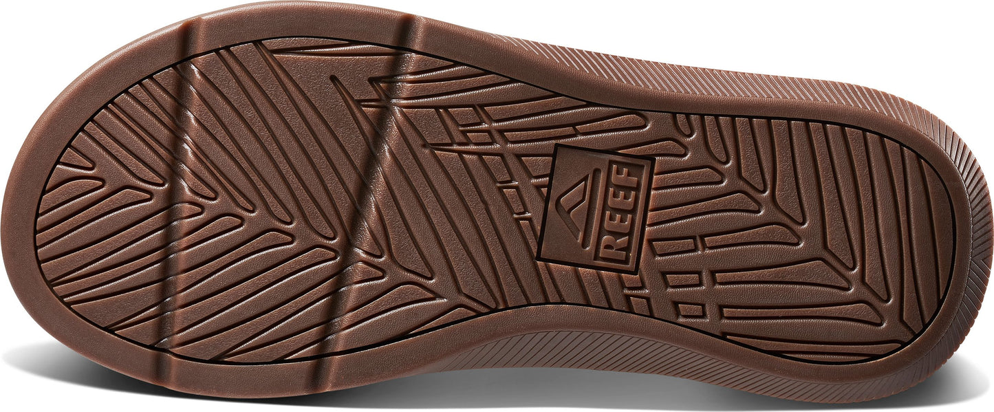 Brown sole with leaf pattern and the text "REEF".