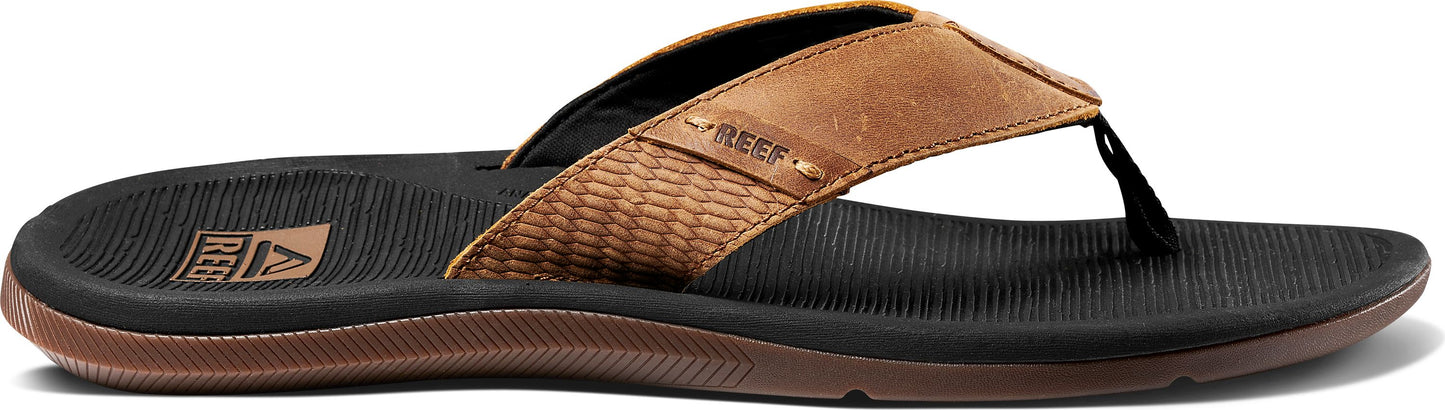 A brown leather sandal with black rubber sole.