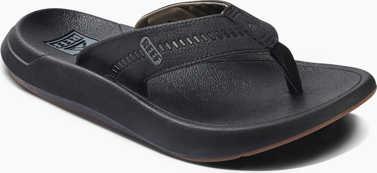 A black leather sandal.