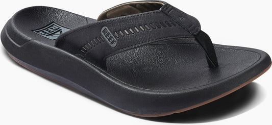 A black leather sandal.