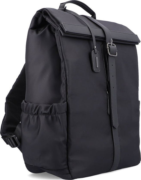 A black casual backpack with a top flap held down by a long strap and buckle.